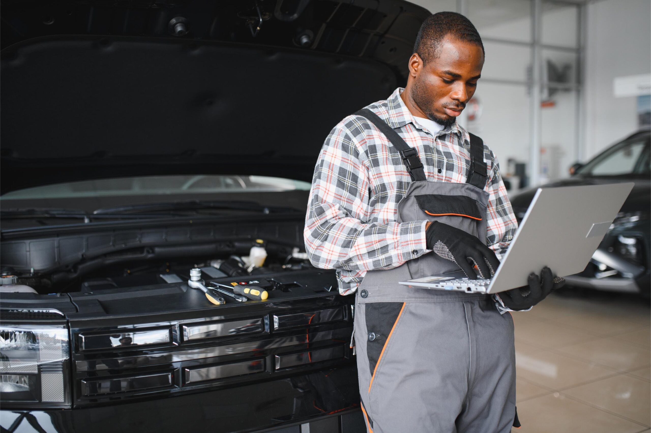 portrait-of-smiling-mechanic-in-car-service-orderi-2025-03-13-21-11-24-utc